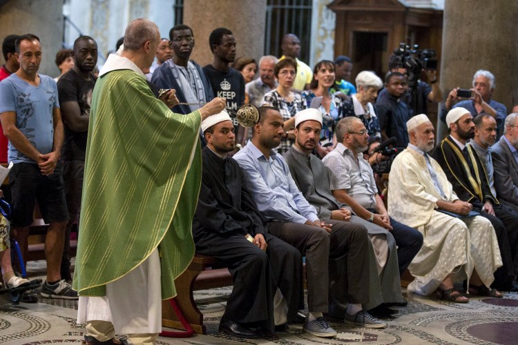 Muslims attend a Mass in Rome's St. Mary in Trastevere church on Sunday. 
Massimo Percossi/Ansa via AP