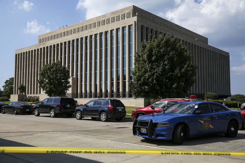 Police tape surrounds the Berrien County Courthouse on Monday in St. Joseph, Mich. Two bailiffs were fatally shot Monday inside the courthouse before officers killed the gunman, a sheriff said.