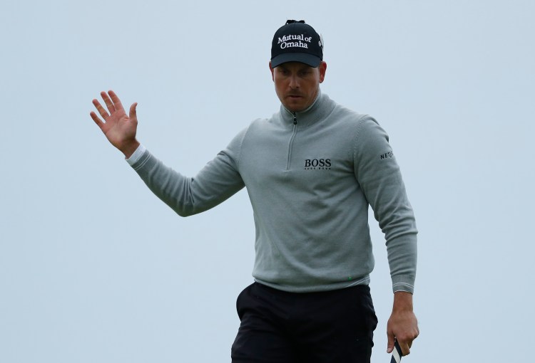 Henrik Stenson of Sweden acknowledges the crowd after putting and making a birdie on the 17th green during the third round of the British Open Golf Championship at the Royal Troon Golf Club in Troon, Scotland, on Saturday.
AP Photo/Ben Curtis