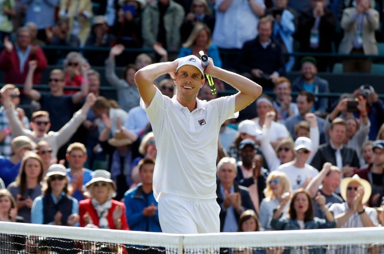 Sam Querrey of the U.S celebrates after beating Novak Djokovic of Serbia in their men's singles match on day six of the Wimbledon Tennis Championships in London, Saturday. Associated Press/Alastair Grant)