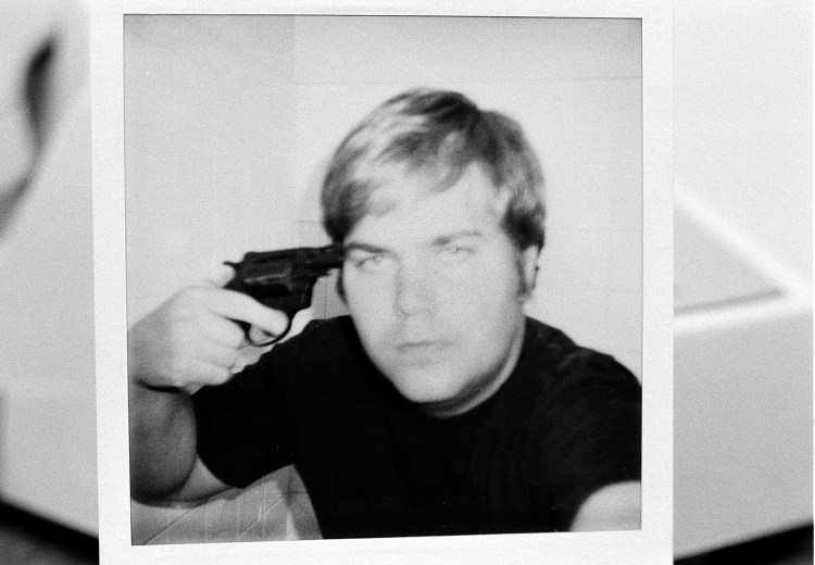 John W. Hinckley Jr., who attempted to assassinate President Ronald Reagan in March 1981, holds a pistol to his head in this self-portrait obtained from court records in Oct. 1982.  The FBI released the polaroid image, which was part of the evidence used in Hicnkley's trial. A judge ruled that Hinckley will be released from a federal psychiatric facility after more than 35 years.