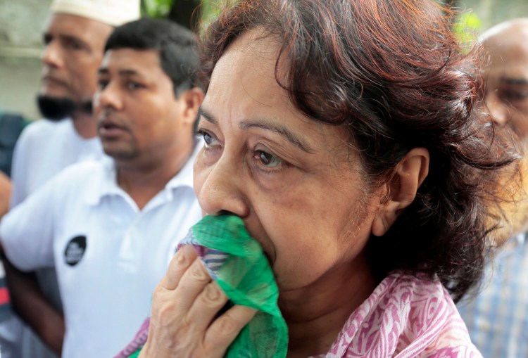 Hosne Ara Karim, whose son and daughter-in-law were rescued from the restaurant that was attacked by heavily armed militants, waits for them in Dhaka, Bangladesh, Saturday, after Bangladesh forces stormed the restaurant where militants held dozens of people hostage for 10 hours. Associated Press
