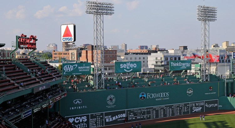 The iconic Citgo sign looms in the background of Fenway Park in Boston. The Boston Landmarks Commission meets Tuesday to decide whether to launch a study to determine if the sign qualifies for preservation as an historic landmark. 