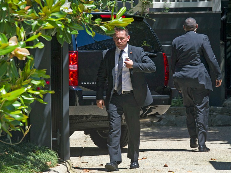 Secret Service personnel stand guard after a vehicle arrived at the home of Democratic presidential candidate Hillary Clinton in Washington on Saturday. Associated Press/Cliff Owen