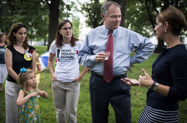 U.S. Sen. Tim Kaine, D-Va., speaking with, from left, Lilly Thornblad, 4, Jennifer Hoppe, Aimee Tavares and Shannon Watts during a Moms Demand Action: For Gun Sense in American event on Capitol Hill.