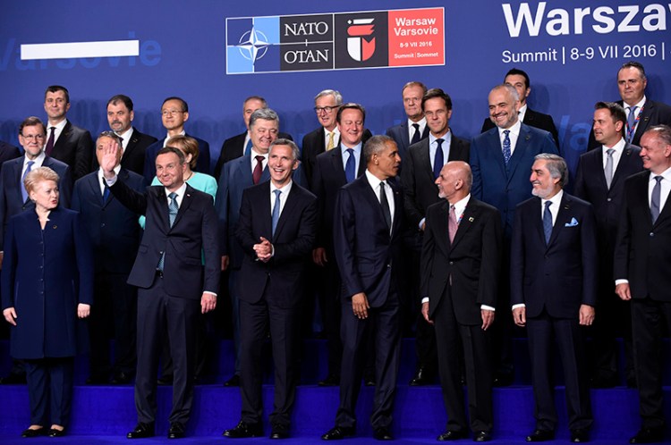 President Barack Obama, center, participates in a NATO family photo in Warsaw on Friday. Front row, from left are, Lithuanian President Dalia Grybauskaitė, Polish President Andrzej Duda, NATO Secretary General Jens Stoltenberg, Obama and Afghanistan's President Ashraf Ghani is right of Obama. Afghanistan's Chief Executive Dr. Abdullah Abdullah, second from right front. 