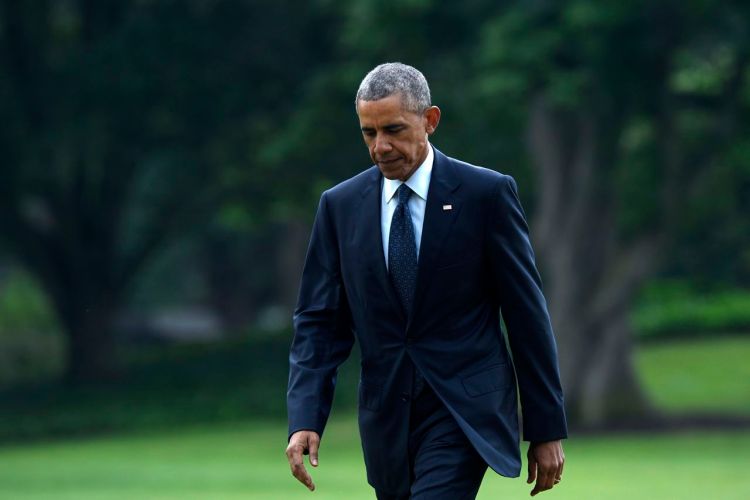 President Barack Obama returns from a trip to Orlando, Fla., on  June 16, 2016, where he consoled those mourning the deadliest mass shooting in modern U.S. history. While Obama continues to try to serve as bridge builder between white and black Americans, protesters and police, he also has had to face the limits of his rhetoric. Susan Walsh/Associated Press