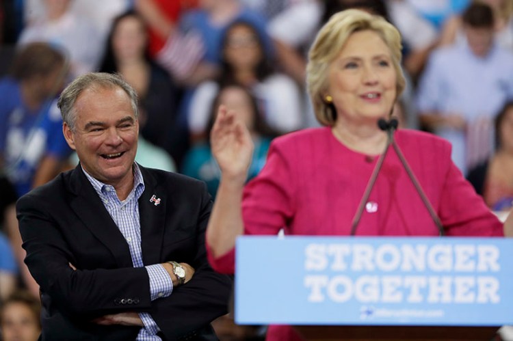 Democratic vice presidential candidate, Sen. Tim Kaine, D-Va. reacts as Democratic presidential candidate Hillary Clinton speaks during a campaign at Temple University on  Friday.