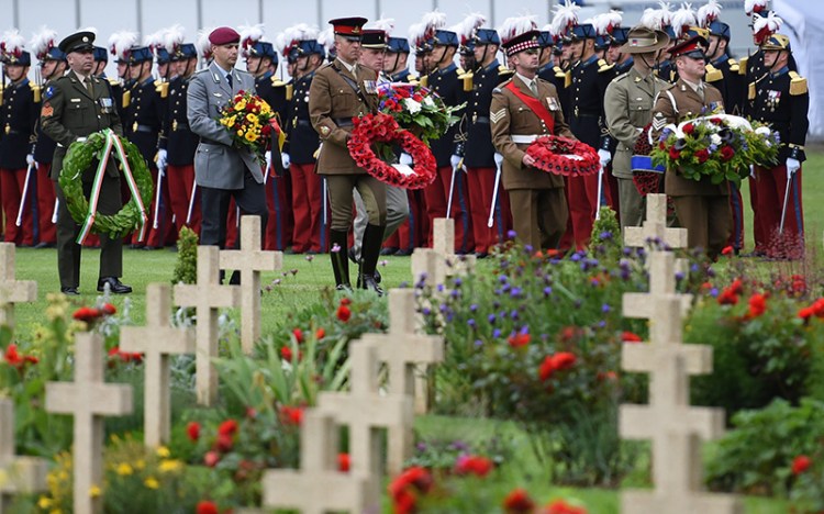 Soldiers leave sprays of flowers during a ceremony commemorating the centenary of the deadliest battle of WWI,  at the Thiepval WWI cemetery, northern France. 
