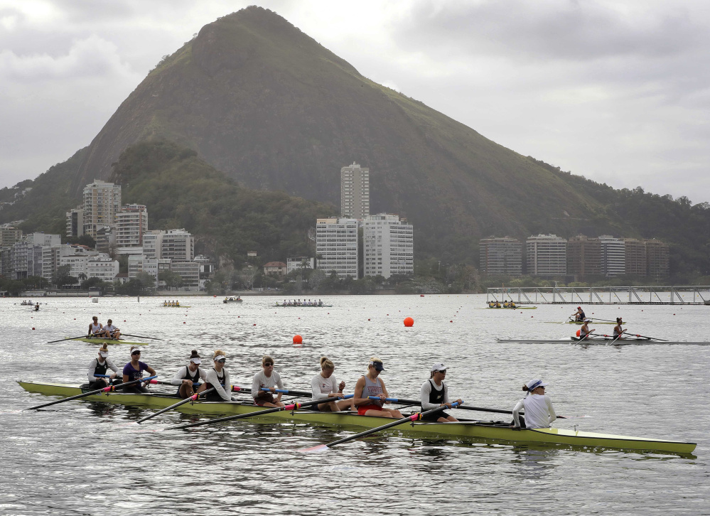 The women's eight rowing team from the United States, including Eleanor Logan of Boothbay Harbor, third from the right, warms up during team practices before the Summer Olympics in Rio de Janeiro. 