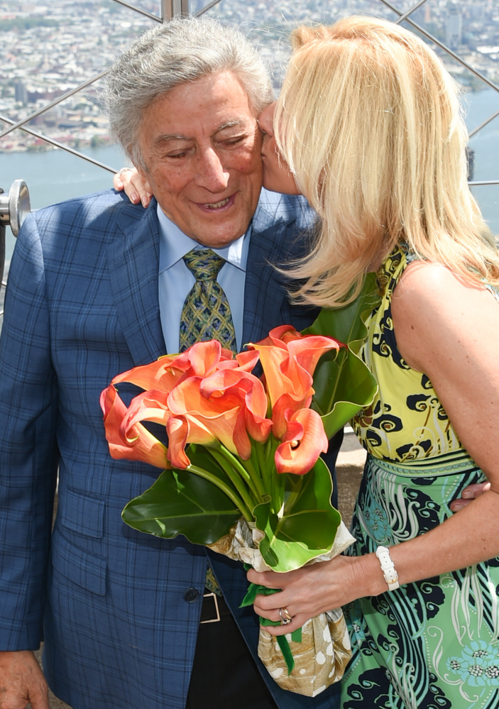 Tony Bennett gets a kiss from his wife, Susan Crow, at the Empire State Building.