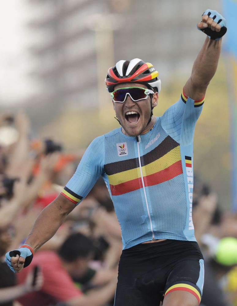 Greg Van Avermaet of Belgium celebrates after crossing the finish line to win the men's cycling road race.