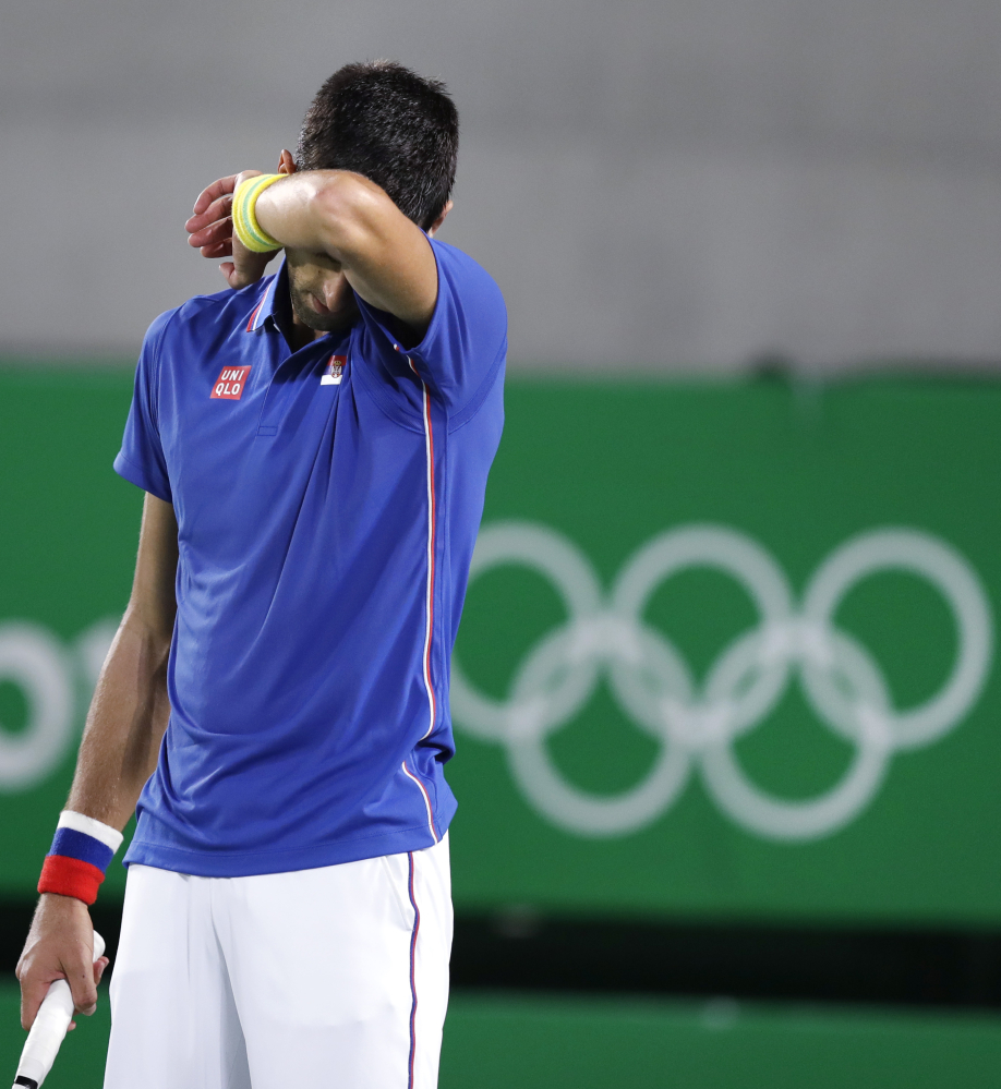 Novak Djokovic, seen during his loss Sunday night against Juan Martin del Potro of Argentina, lost his chance for a 2016 Olympic medal with a straight-sets loss in doubles Monday night.