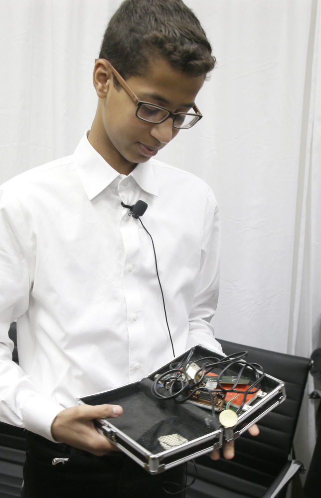 Ahmed Mohamed shows the clock he built in a plastic school pencil box to reporters after a news conference in Dallas on Monday.