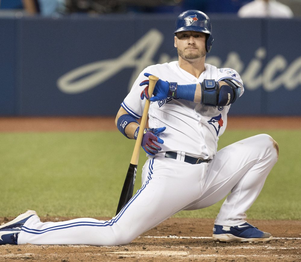 Toronto's Josh Donaldson drops to one knee after being backed off by a pitch in the fourth inning of Monday's game against the Tampa Bay Rays in Toronto.