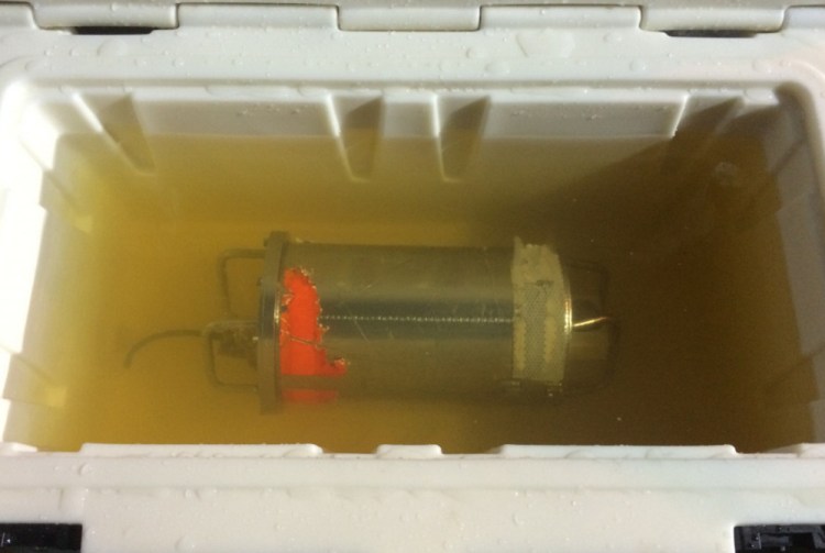 El Faro's voyage data recorder sits in fresh water aboard the USNS Apache tug. It was recovered Monday.