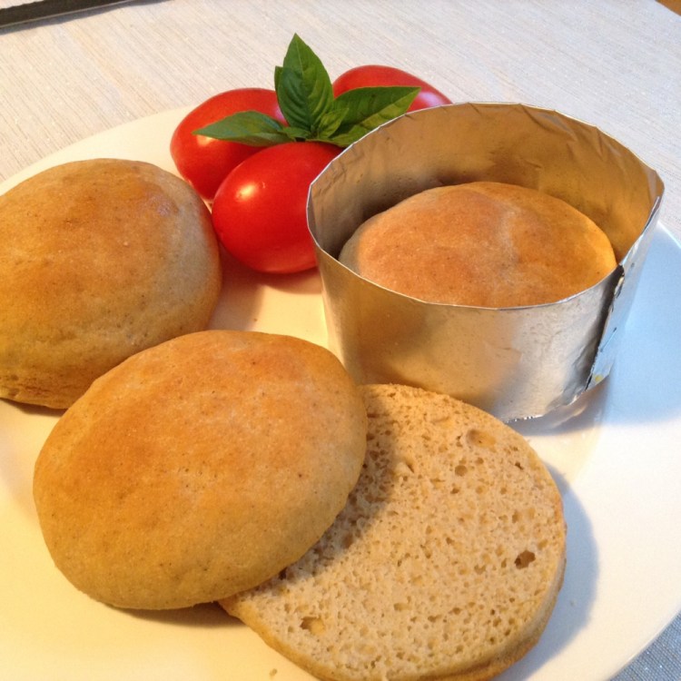 Homemade gluten-free hamburger buns featured a nicely textured, tender crumb. Creating a 4-inch aluminum foil collar or ring mold helps these buns keep a round form and rise higher.