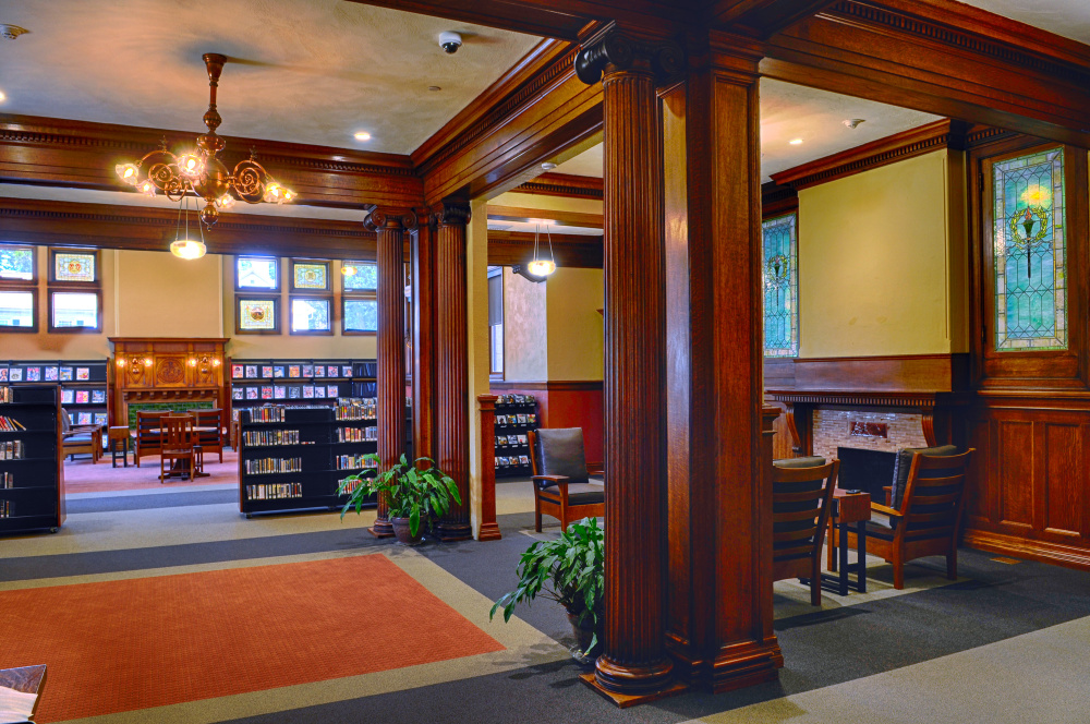 This fireside lounge, shown Tuesday, occupies the spot where the circulation desk of Augusta's Lithgow Public Library stood before its recent renovation and expansion. A painting of namesake Llewellyn Lithgow will be hung before the library reopens on Saturday.