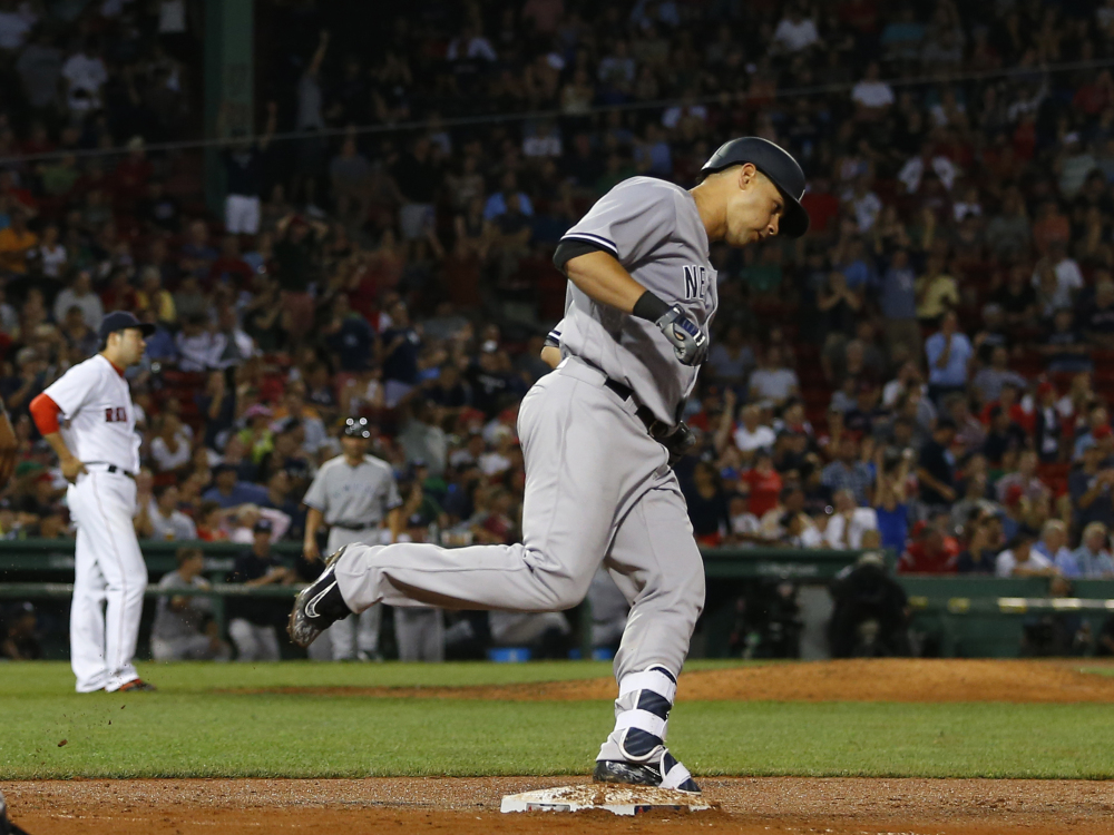 The Yankees' Gary Sanchez rounds the bases after hitting a home run off Red Sox reliever Junichi Tazawa in the eighth inning of New York's 9-4 win Wednesday night. Boston led 4-1 at one point. It was Sanchez's first major league home run.