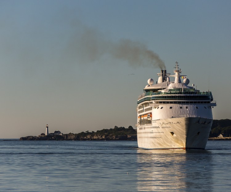 Smoke billows from the stack as the cruise ship Grandeur of the Seas, a regular visitor to Portland Harbor, arrives in August 2016.