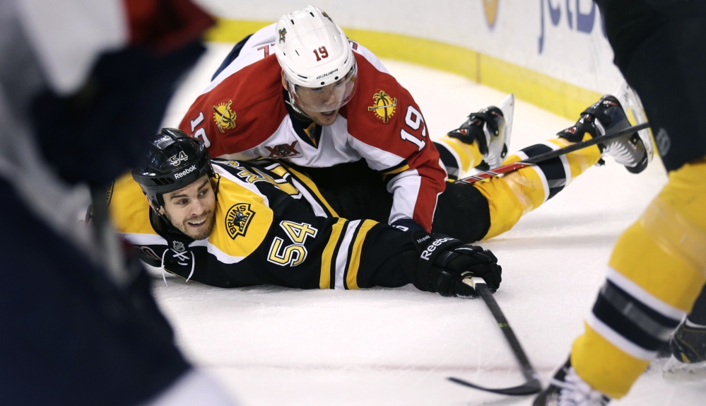 Boston defenseman Adam McQuaid, bottom, was able to spend more time upright this offseason – his first in three years in which he did not have to have surgery of one type or another.