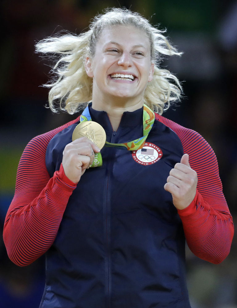 Kayla Harrison has that gold-medal smile after winning the 78-kilogram class in women's judo, retaining the title she won in 2012 at London.