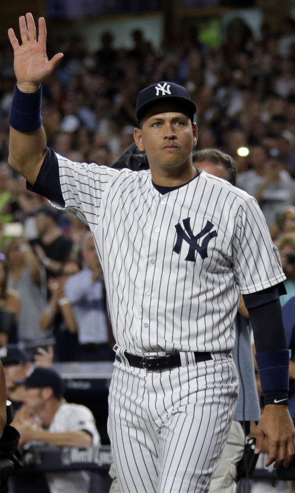 Alex Rodriguez waves to the crowd as he walks onto the field for a ceremony prior to his final game with the New York Yankees, a 6-3 win over the Tampa Bay Rays. A-Rod went 1 for 4 with a double.