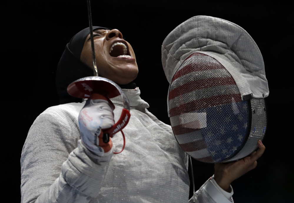 Ibtihaj Muhammad celebrates after winning a point to Russia in a women's team sabre fencing semifinal at the 2016 Summer Olympics in Rio de Janeiro, Brazil, on Saturday.
Associated Press/Andrew Medichini