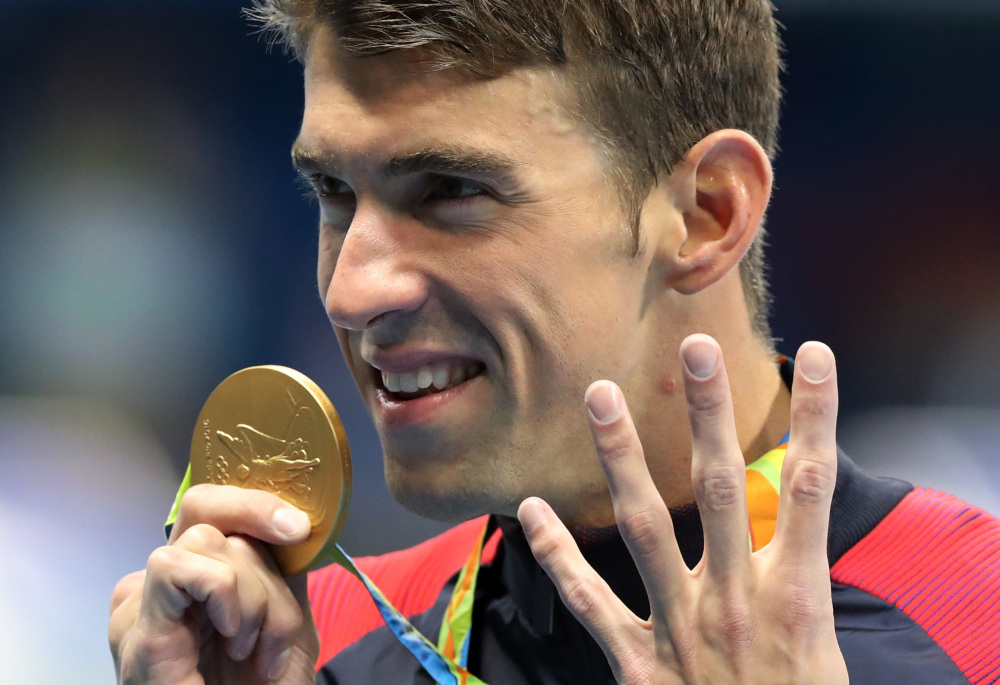 Michael Phelps celebrates winning the gold medal in the men's 200-meter individual medley during the swimming competitions at the 2016 Summer Olympics on Thursday in Rio de Janeiro, Brazil.