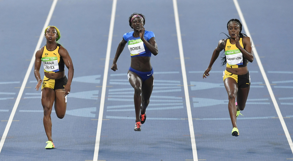 Jamaica's Elaine Thompson, right, United States' Tori Bowie, center, and Jamaica's Shelly-Ann Fraser-Pryce compete in the women's 100-meter final during the 2016 Summer Olympics in Rio de Janeiro, Brazil, on Saturday.