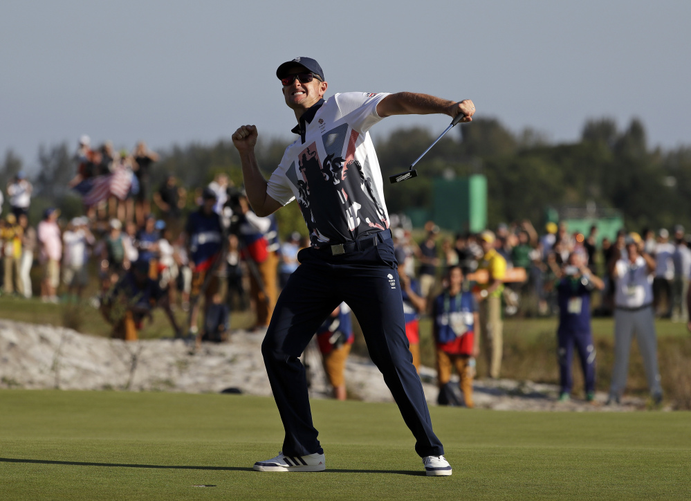 Justin Rose of Great Britain wins the gold medal in men's golf Sunday at the 2016 Summer Olympics in Rio de Janeiro.