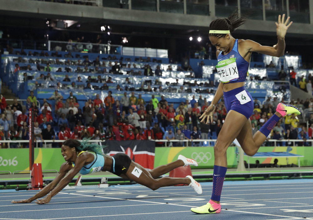 Associated Press/Matt Slocum
Bahamas' Shaunae Miller falls over the finish line to win gold ahead of United States' Allyson Felix, right, in the women's 400-meter final MOnday night in Rio de Janeiro.
