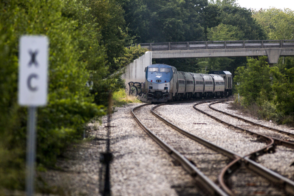 The northbound Amtrak Downeaster heads toward it's stop in Brunswick on Friday. Amtrak secured funding to install a rail siding that will allow the agency to run five daily round trips between Brunswick and Boston. The Downeaster now only runs two-round trips between Brunswick and Boston, but will add a third when it completes a layover shed in September.