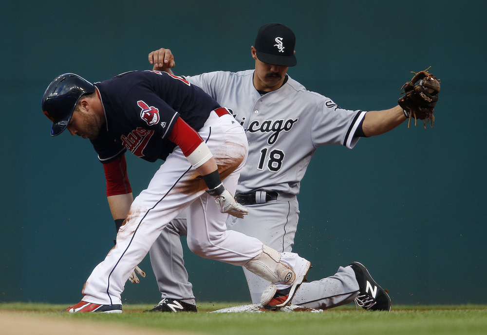 Jason Kipnis of the Cleveland Indians pulls into second base with a double Tuesday night as Tyler Saladino covers for the Chicago White Sox. The Indians won, 3-1.
