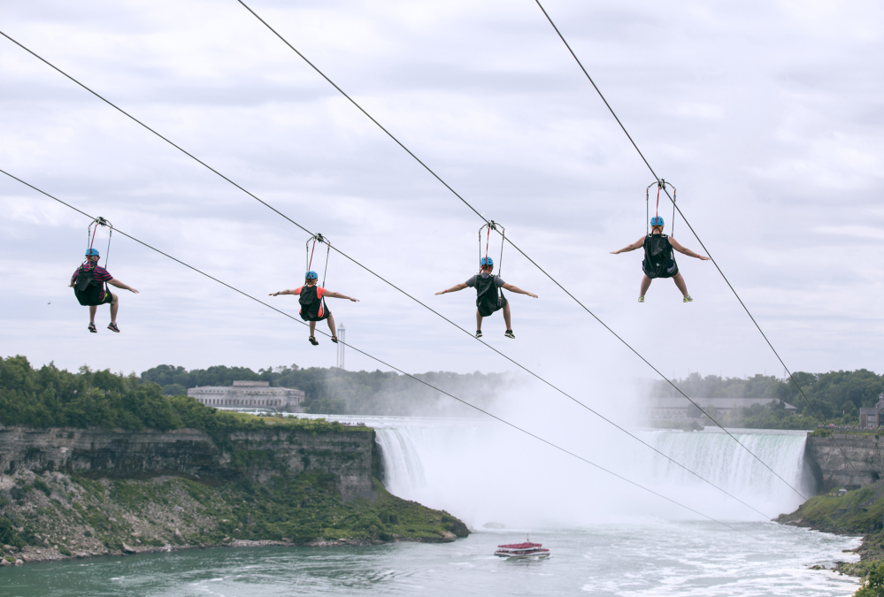 Tourists ride zip lines last month at speeds of up to 40 mph toward the mist of the Horseshoe Falls on the Ontario side of Niagara Falls.
