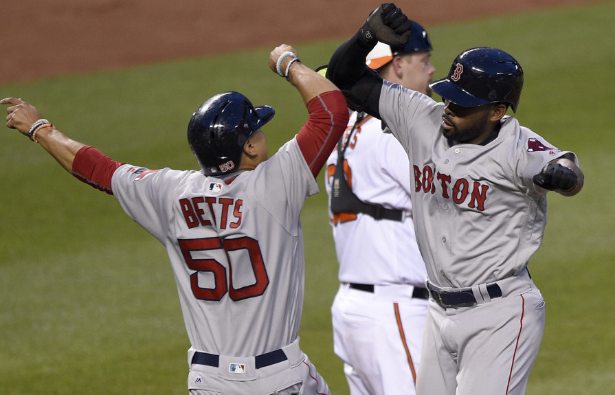 Jackie Bradley Jr. of the Boston Red Sox, right, is welcomed by Mookie Betts after hitting a two-run homer Wednesday night in the third inning of the 8-1 victory against the Baltimore Orioles.