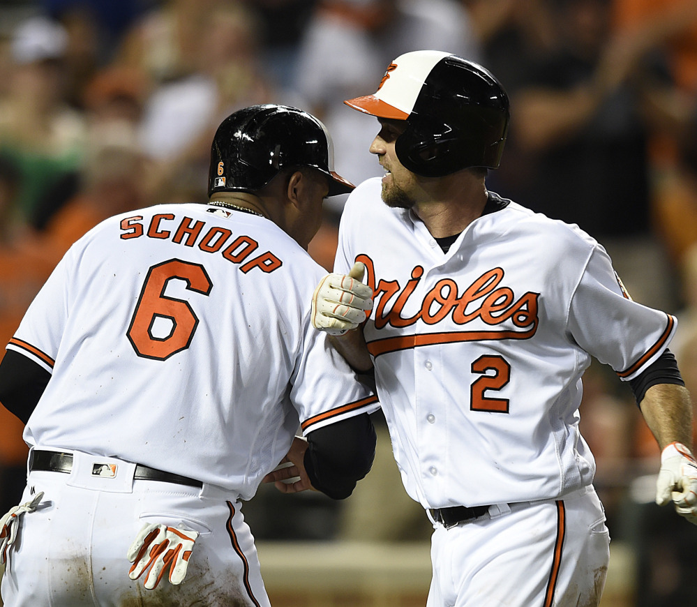 Baltimore's J.J. Hardy, right, celebrates his two-run homer with Jonathan Schoop, who also scored on the play, in the fourth inning of the Orioles' 13-5 victory over Houston at home. Baltimore matched a season high in runs scored.