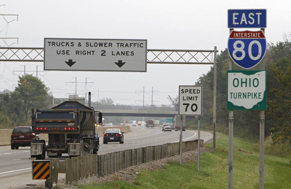 In this Sept. 29, 2011, file photo, vehicles drive along the Ohio Turnpike in Strongsville. Ohio Turnpike Executive Director Randy Cole said testing of self-driving vehicles could begin on the toll road in late 2016 or in 2017. Cole says the route that takes Interstate 80 from Pennsylvania to Indiana is set up well for testing autonomous vehicles because it already has a fiber-optic network along the entire roadway.