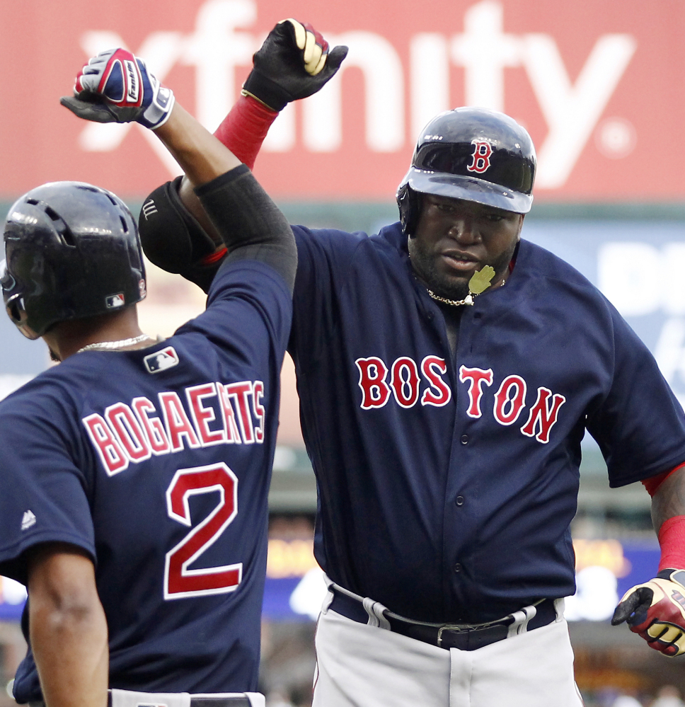 Boston's David Ortiz, right, celebrates with Xander Bogaerts after his two-run homer in the first inning that started the Red Sox on the way to a 10-2 rout against the host Detroit Tigers.