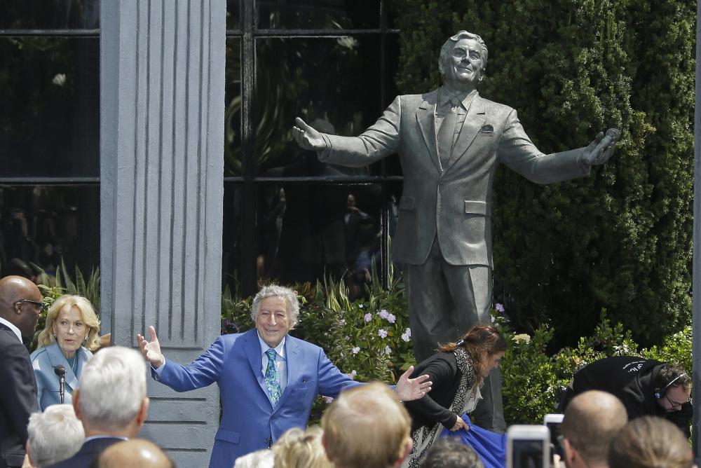 Tony Bennett gestures after his statue is unveiled outside the Fairmont Hotel in San Francisco on Friday. He turned 90 on Aug. 3.