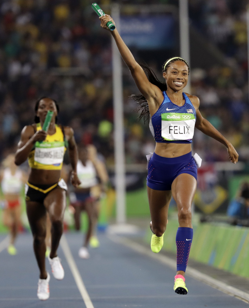 Allyson Felix of the U.S. celebrates as she crosses the finish line of the 1,600-meter relay, earning a record sixth career gold medal.