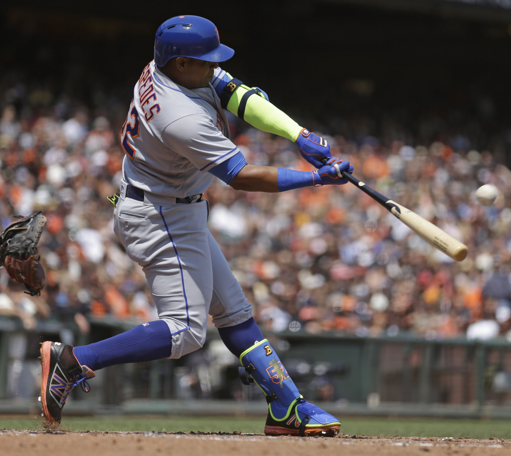 Yoenis Cespedes of the Mets connects for a home run off Giants starter Matt Moore in the third inning – his first of two homers Saturday in a 7-2 road victory.