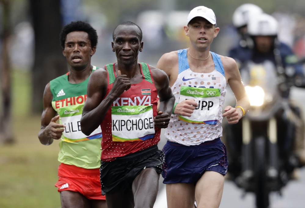 Eliud Kipchoge of Kenya leads Feyisa Lilesa of Ethiopia and Galen Rupp of the U.S. late in the marathon before pulling away to win in a time of 2 hours, 8 minutes, 44 seconds. Lilesa took the silver medal and Rupp won bronze.
Associated Press/Robert F. Bukaty
