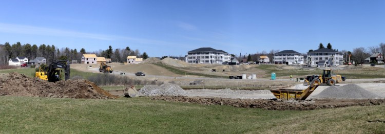 Blue Spruce Farm, seen under construction in April, could bring a total of about 500 housing units to Westbrook. Residents worry about the impact on city schools.