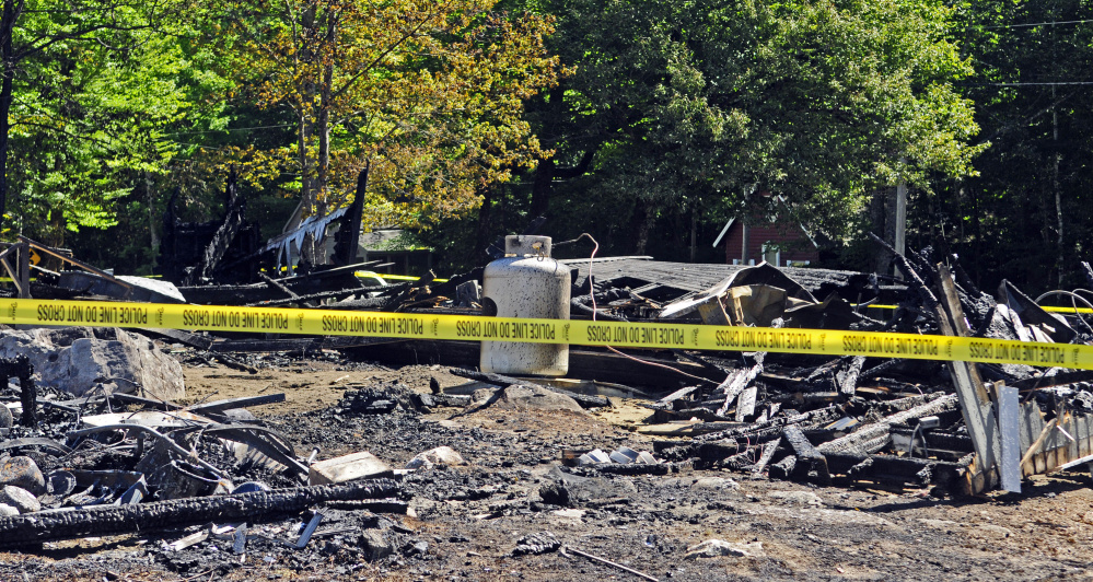 Debris and ashes are all that remain of six buildings that burned Monday at Washington Advent Christian Camp. The fire's cause is not yet determined.