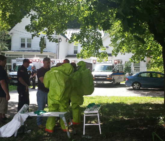 Members of the Waterville Fire Department donned hazmat suits to respond after a resident overused bug spray Thursday afternoon at an apartment on upper Main Street.