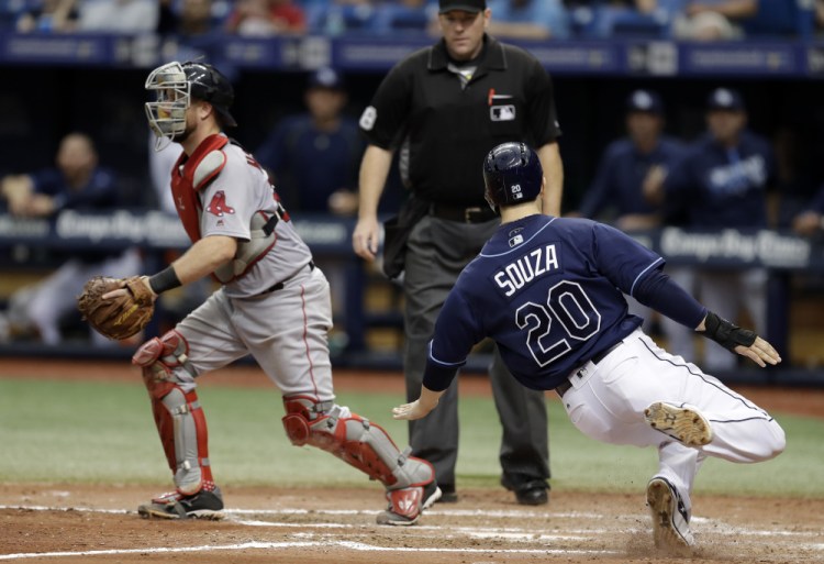 The Rays' Steven Souza Jr. slides home safely on a double by Mikie Mahtook, scoring what proved to be the winning run in the seventh inning of a Thursday's game in St. Petersburg, Fla.