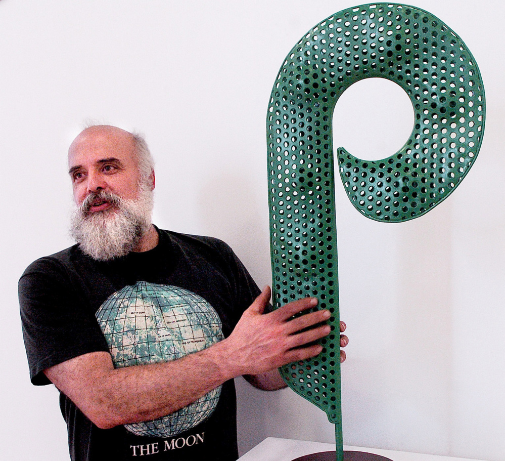 Jay Sawyer, shown with his "P Pod," creates his artwork entirely of reused and repurposed material.