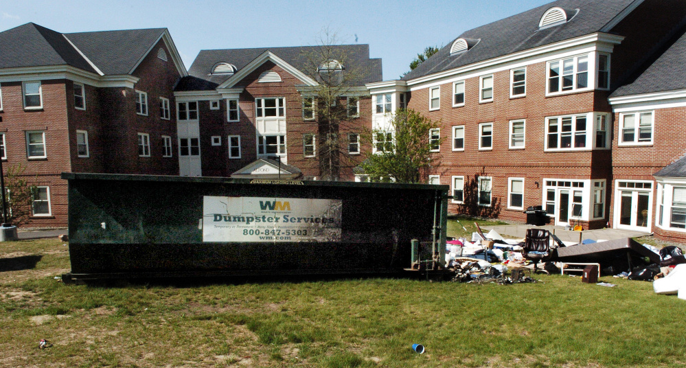 A dumpster loaded with items from Colby College students was damaged by fire May 22 outside the Alfond dormitory on the campus in Waterville. The Kennebec County district attorney said this week that the office is closer to charging former students in the fire.
