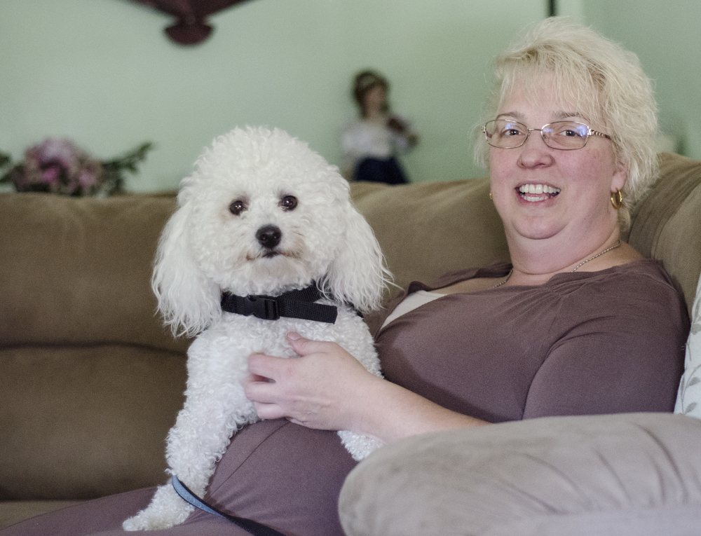 Fitchburg, Mass., resident Lorelei McClure has her own Prince Charming in the form of a 10-inch tall Bichon Frise trained to respond when she's suffering a seizure.